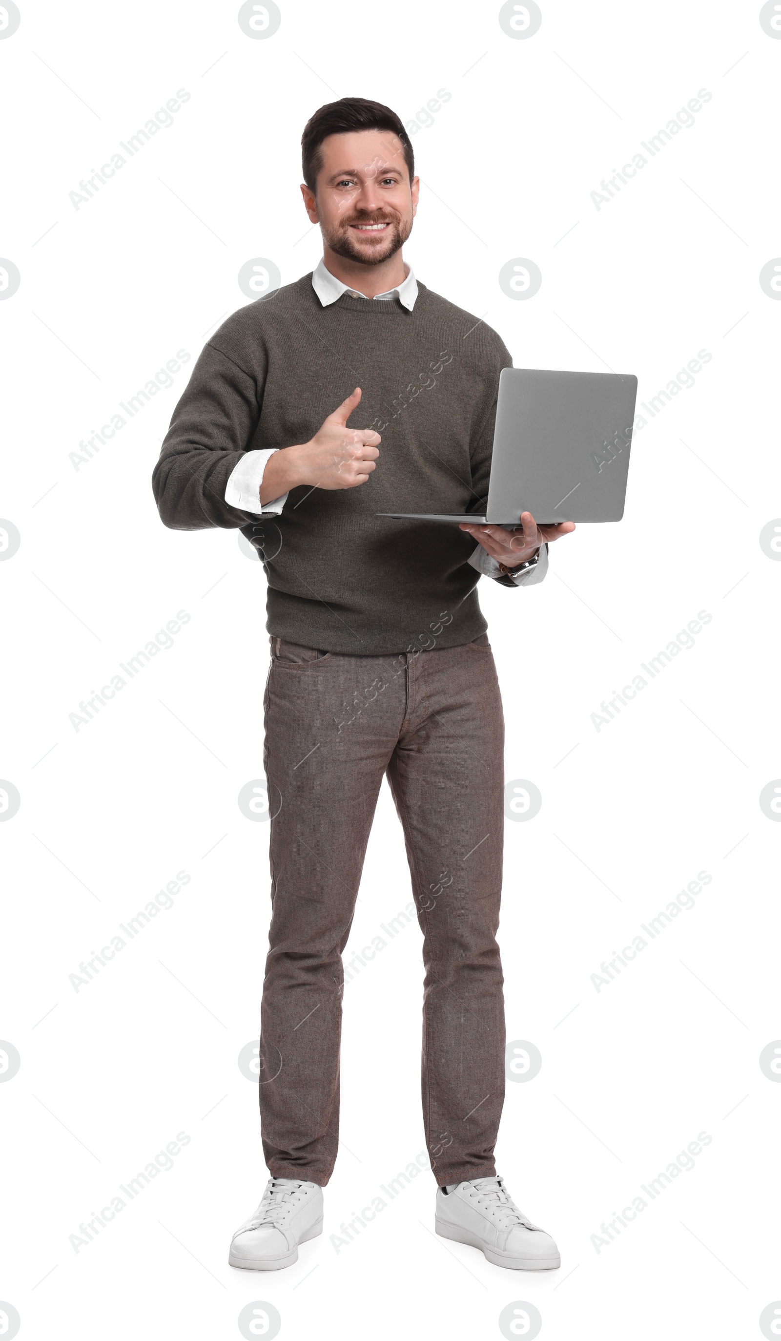 Photo of Handsome bearded businessman with laptop on white background