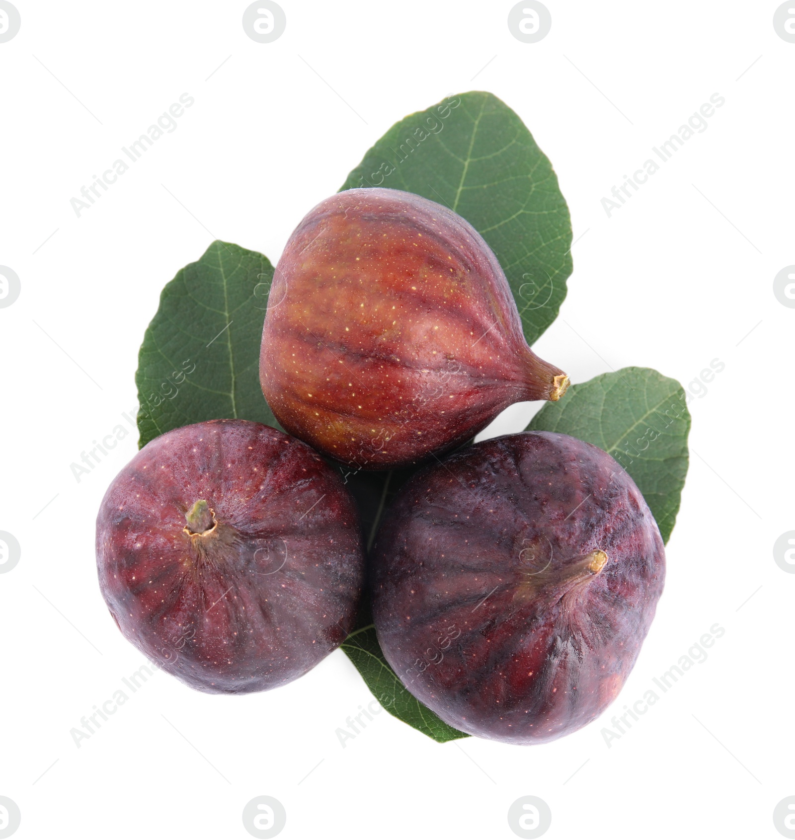 Photo of Fresh juicy purple figs and green leaves on white background, top view