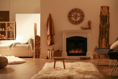 Photo of Beautiful view of cozy living room interior with fireplace