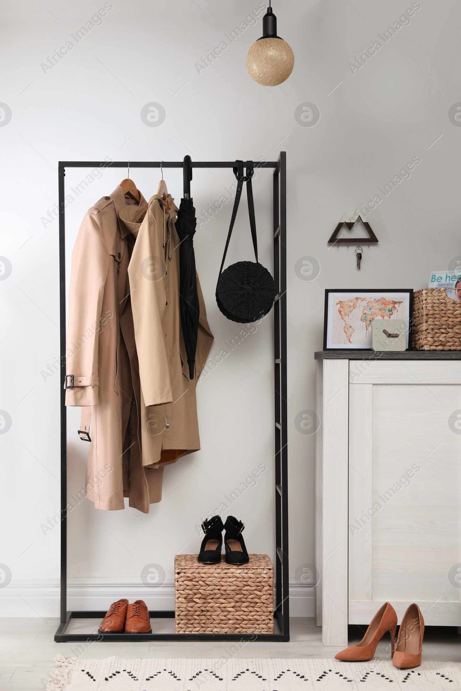 Photo of Modern hallway interior with stylish furniture and key holder