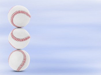 Image of Stack of baseball balls on blue background. Space for text