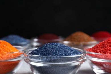 Photo of Many different food coloring on table, closeup