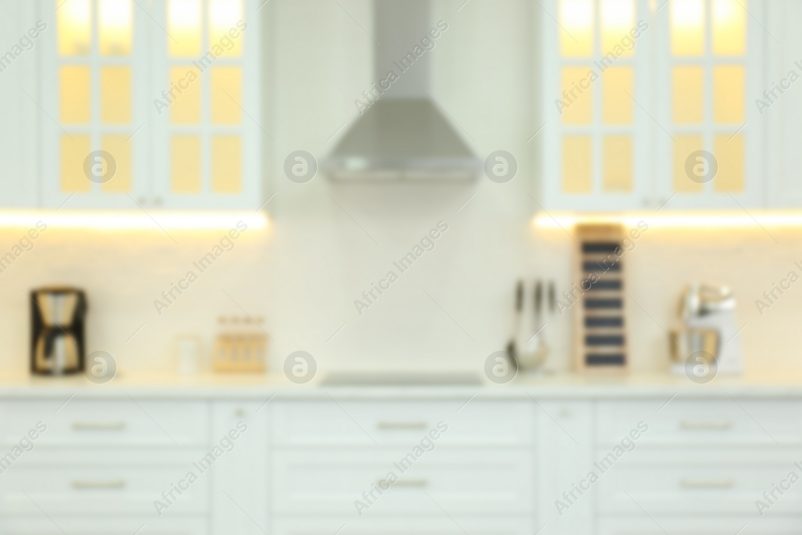 Photo of Blurred view of modern kitchen interior with stylish furniture