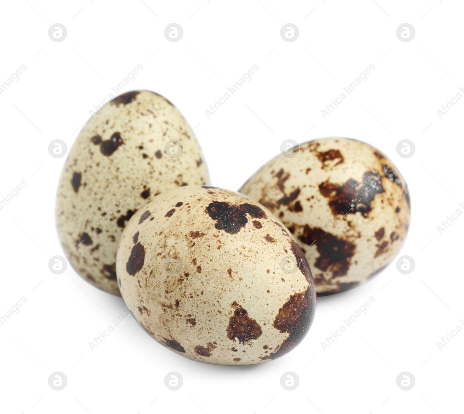 Photo of Three beautiful quail eggs on white background