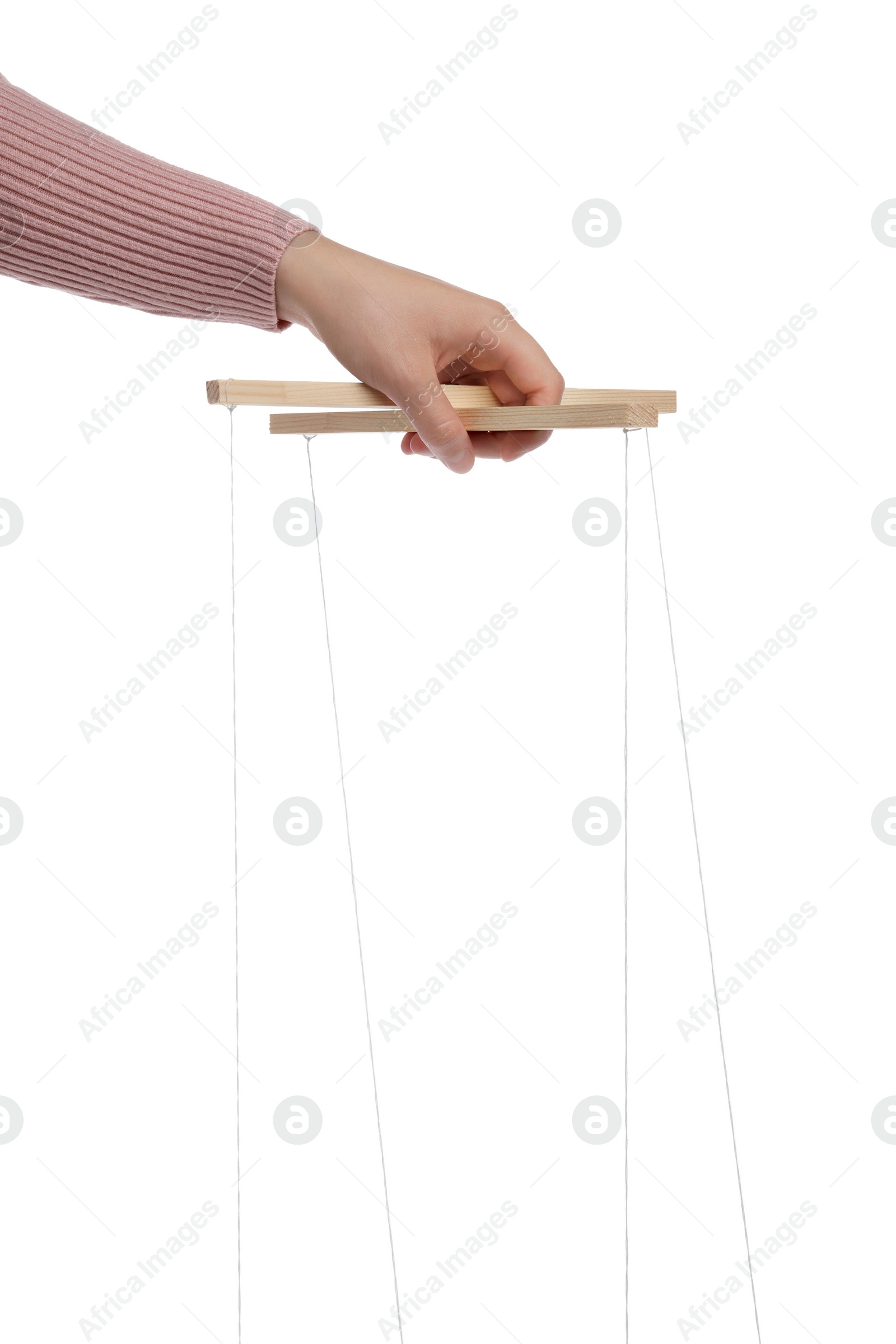 Photo of Woman pulling strings of puppet on white background, closeup