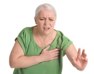 Mature woman having heart attack on white background