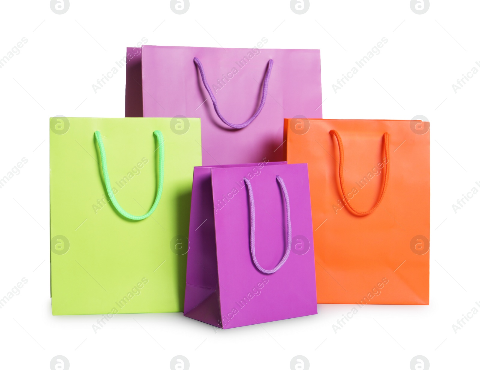 Photo of Colorful paper shopping bags isolated on white