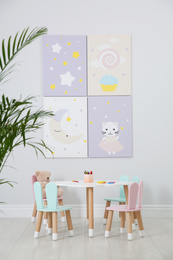 Little table and chairs with bunny ears in children's room. Interior design