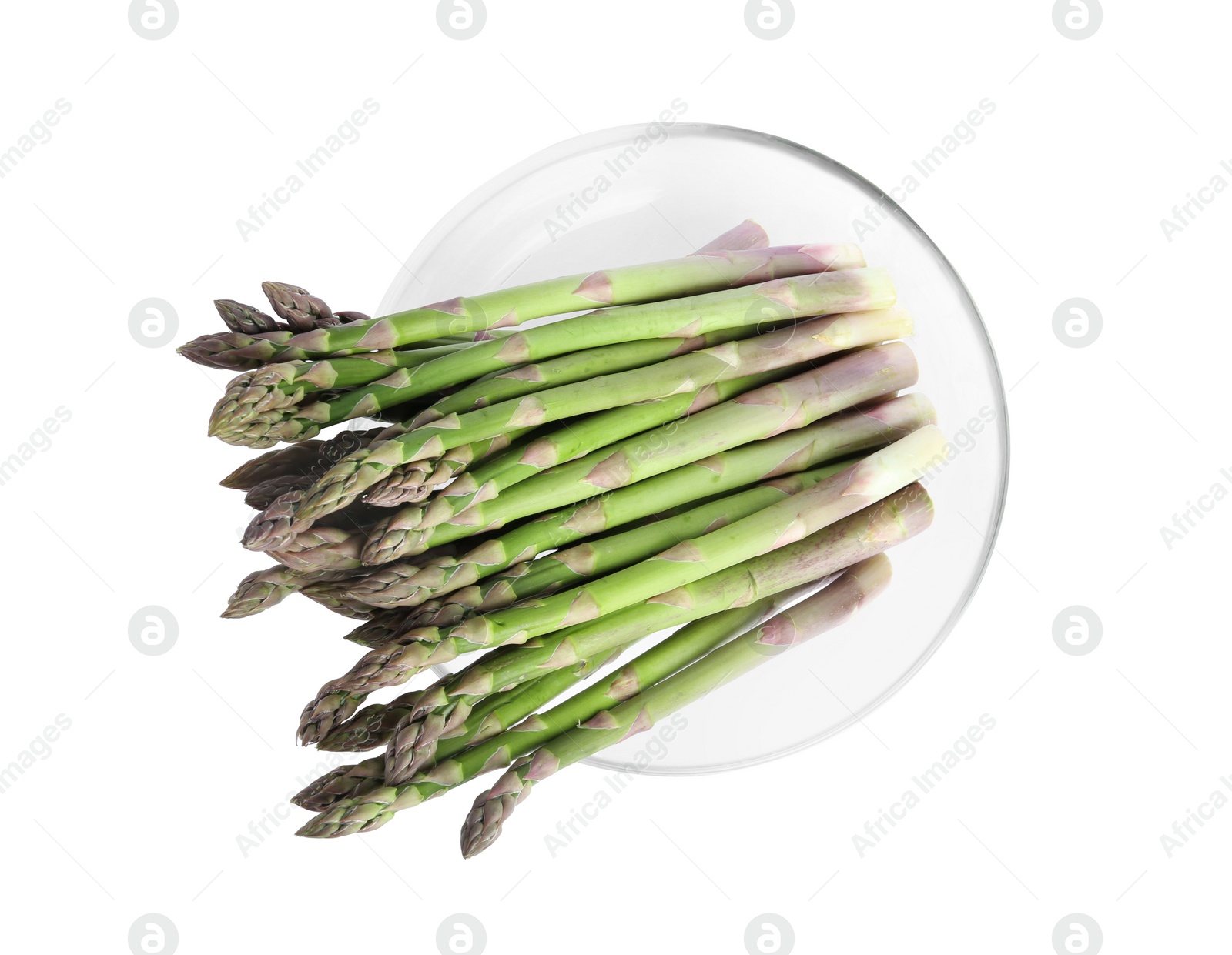 Photo of Raw asparagus in glass bowl isolated on white, top view