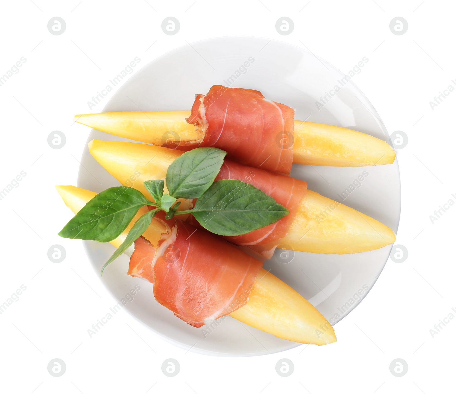 Photo of Plate with melon slices and prosciutto on white background, top view