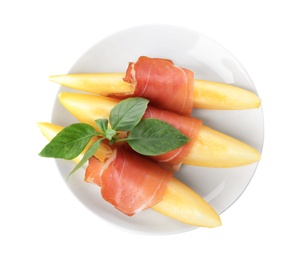 Photo of Plate with melon slices and prosciutto on white background, top view