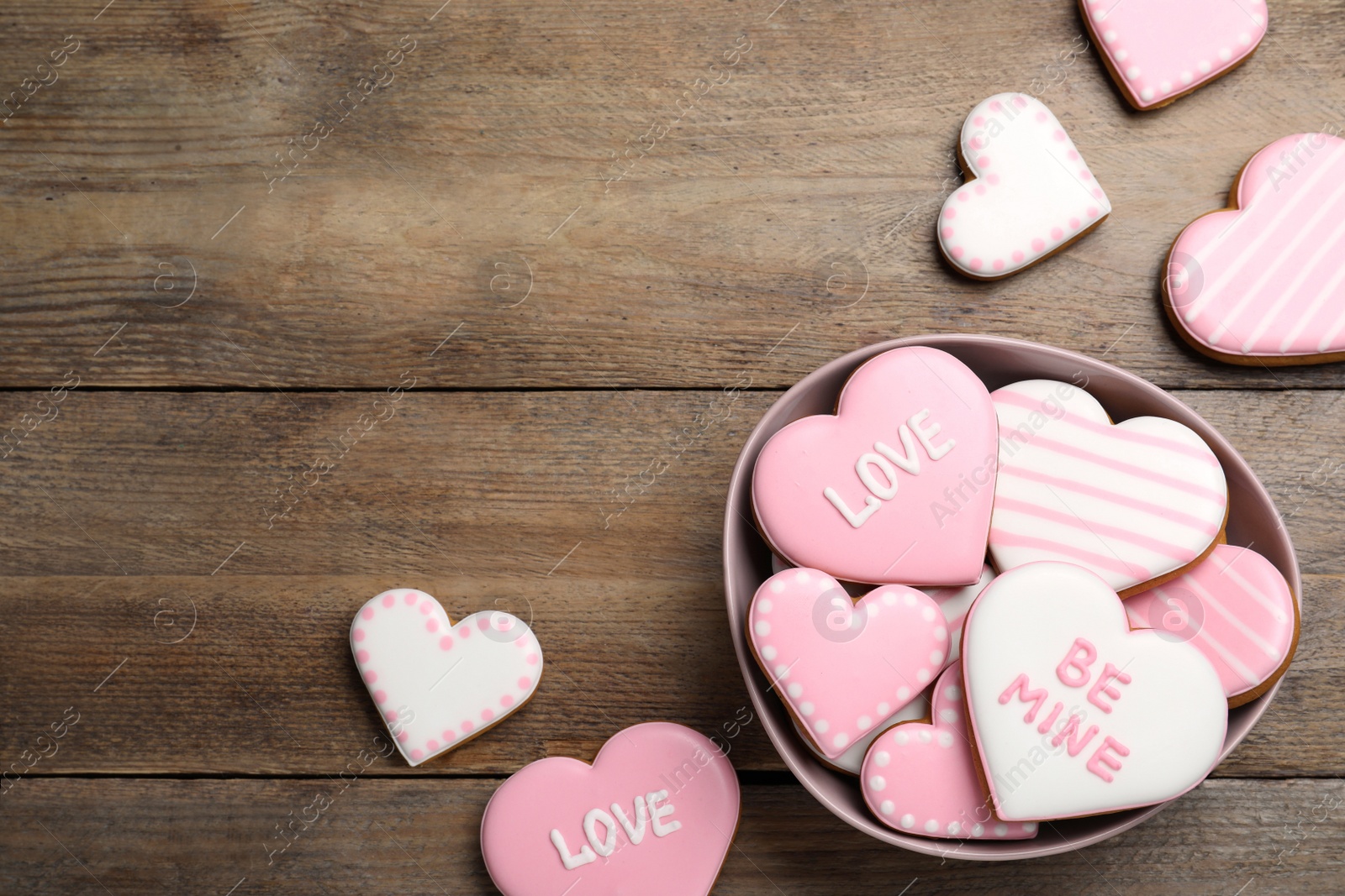 Photo of Heart shaped cookies on wooden table, flat lay with space for text. Valentine's day treat