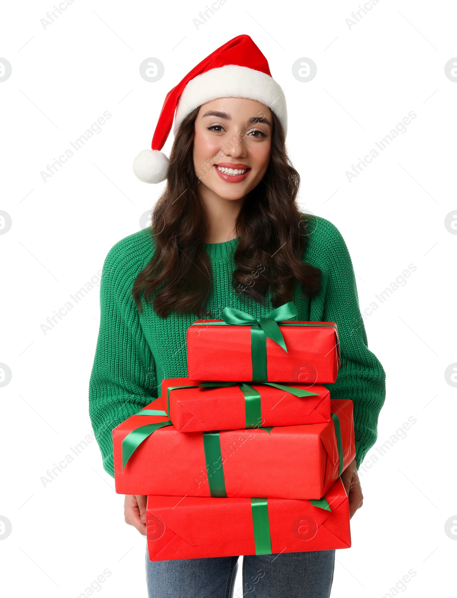 Photo of Beautiful young woman in Santa hat with Christmas gifts isolated on white