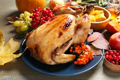 Photo of Composition with delicious turkey on wooden background. Happy Thanksgiving day