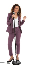 Photo of Curly African-American woman in suit posing with microphone on white background