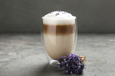 Delicious latte with lavender on grey table