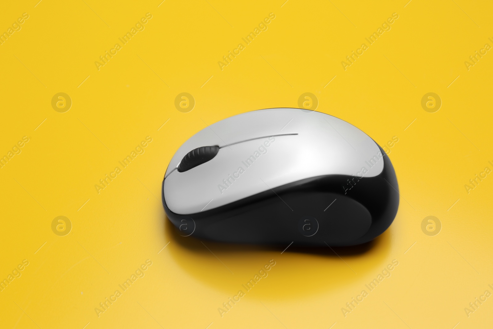 Photo of Wireless computer mouse on color background