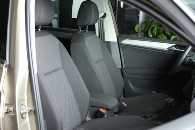 Photo of Modern car interior with comfortable grey seats