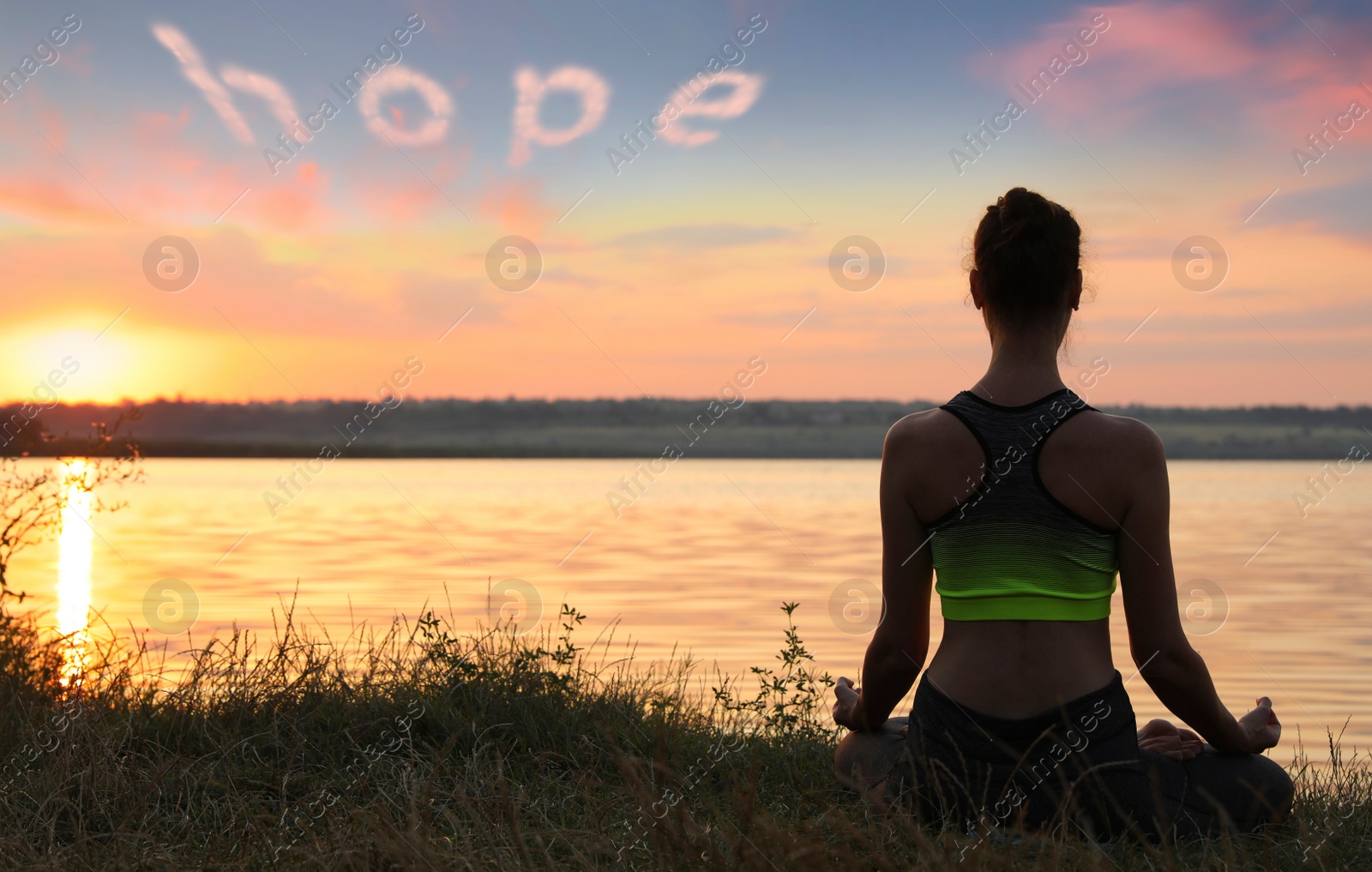 Image of Concept of hope. Woman meditating at sunset, back view