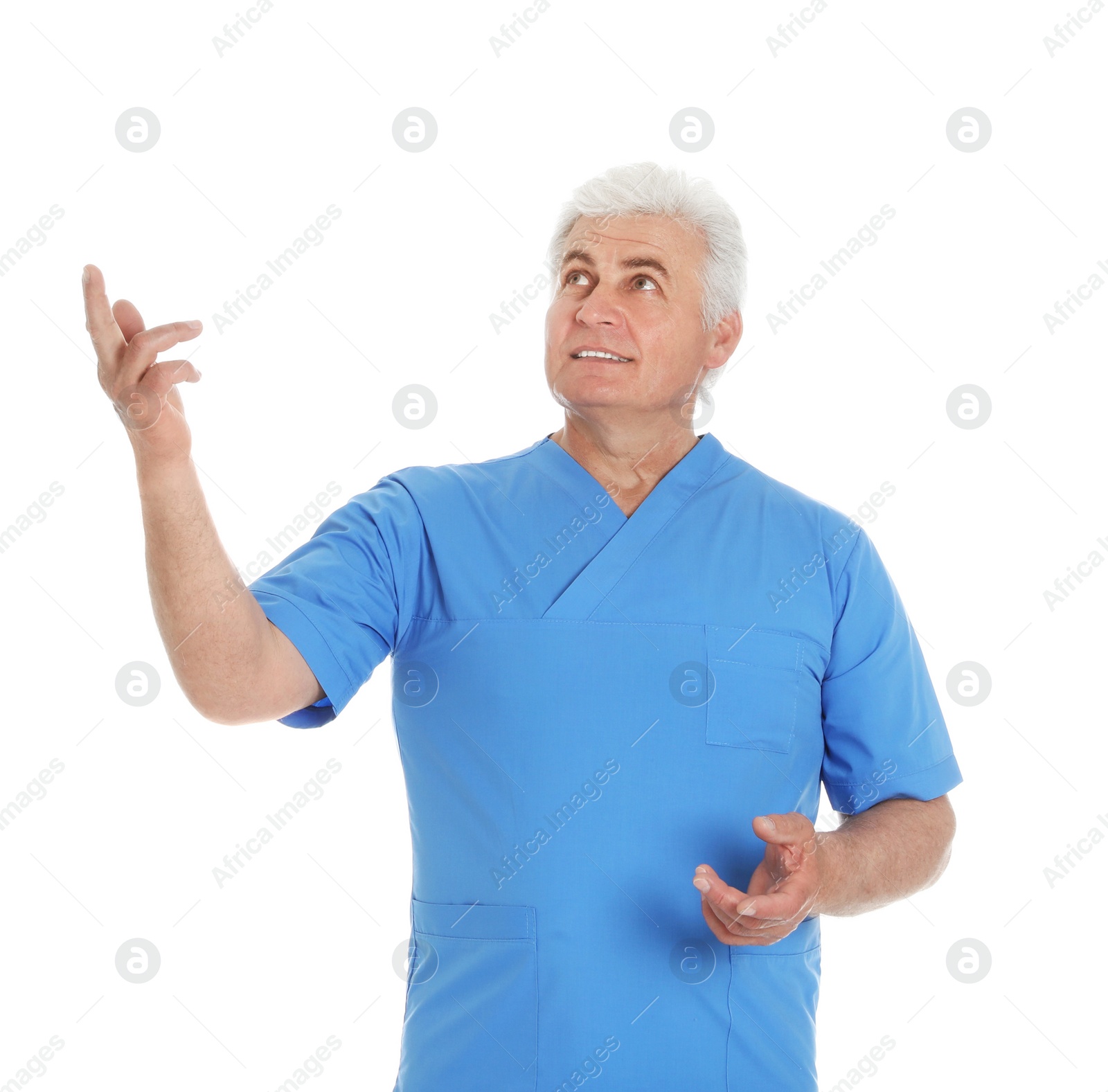 Photo of Portrait of male doctor in scrubs isolated on white. Medical staff