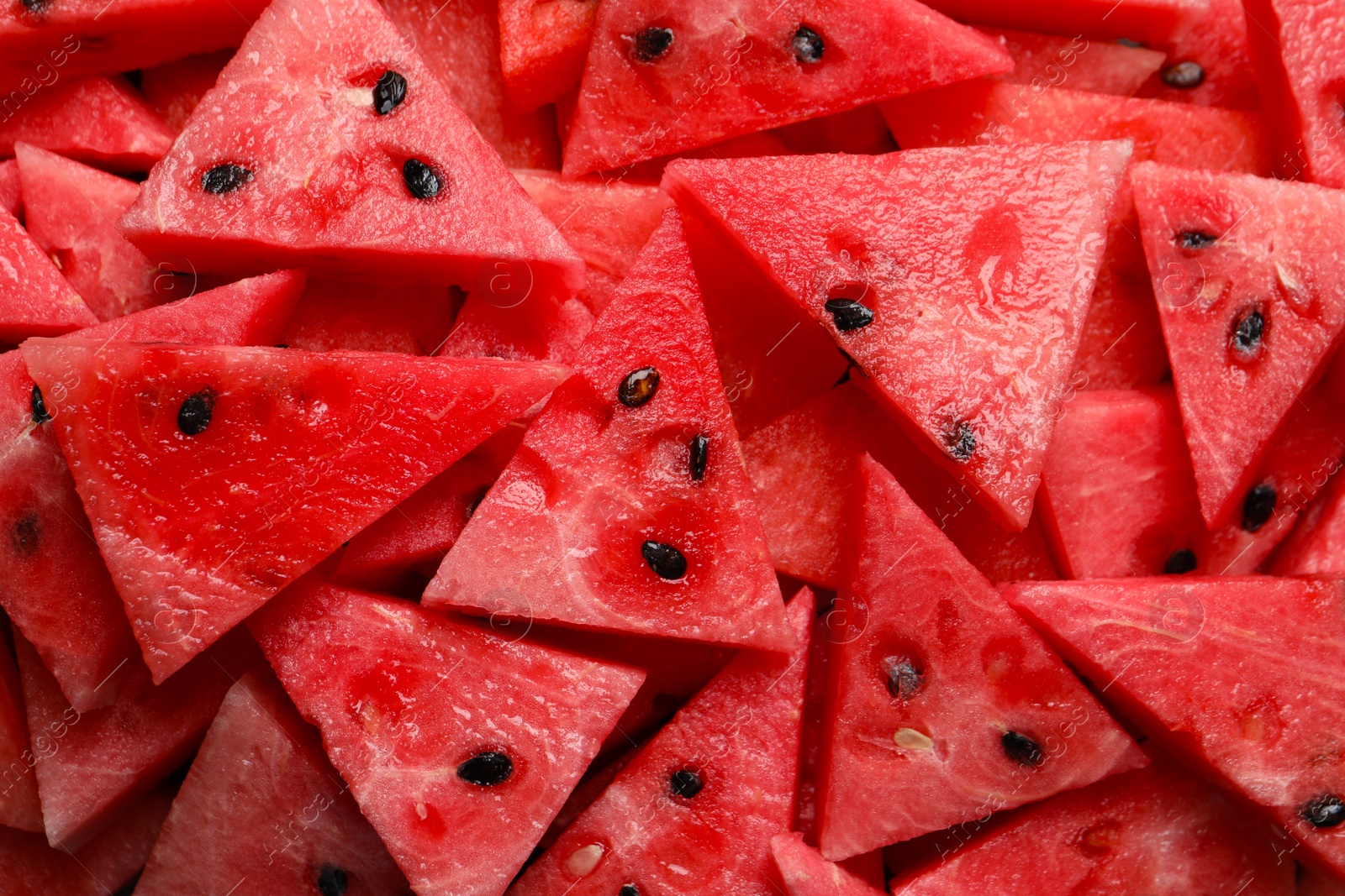 Photo of Delicious fresh watermelon slices as background, closeup