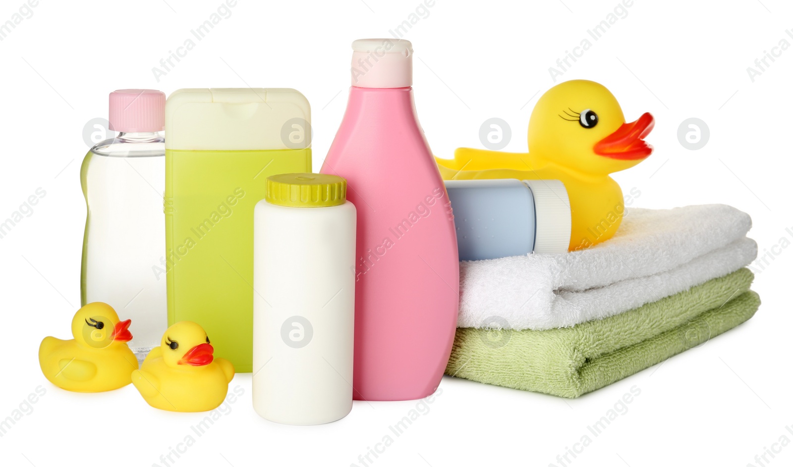 Photo of Bottles of baby cosmetic products, towels and rubber ducks on white background