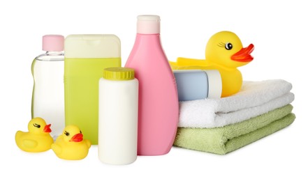 Photo of Bottles of baby cosmetic products, towels and rubber ducks on white background