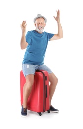 Photo of Senior man with suitcase on white background. Vacation travel
