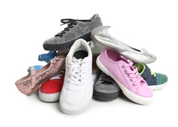 Pile of different shoes on white background