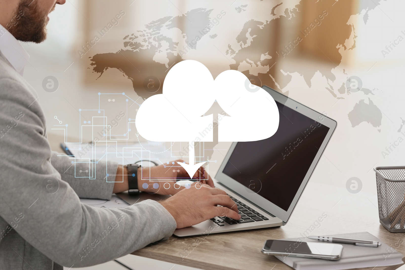 Image of Cloud technology. Businessman using laptop at table in office