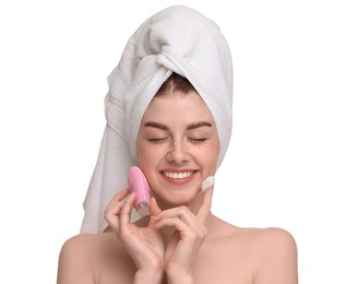Photo of Washing face. Young woman with brush and cleansing foam on white background