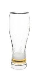 Photo of Almost empty glass of beer isolated on white