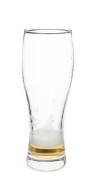 Almost empty glass of beer isolated on white