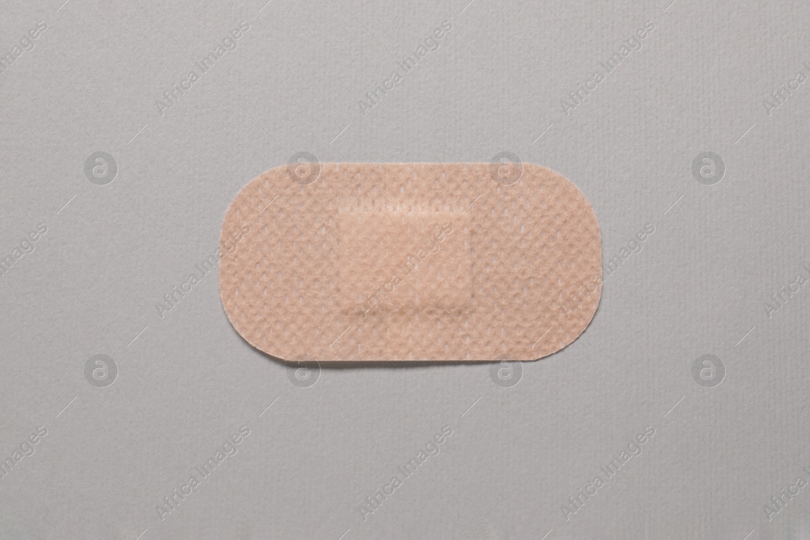 Photo of Contraceptive patch on light grey background, top view