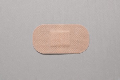 Photo of Contraceptive patch on light grey background, top view