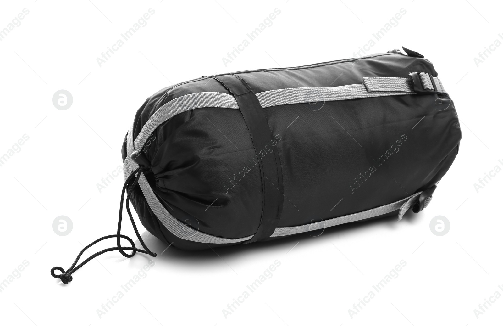 Photo of Sleeping bag in case on white background. Camping equipment