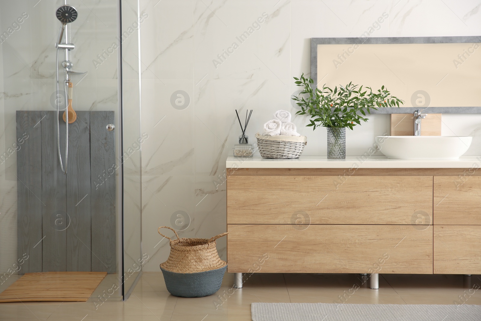 Photo of Modern bathroom interior with stylish mirror and vessel sink