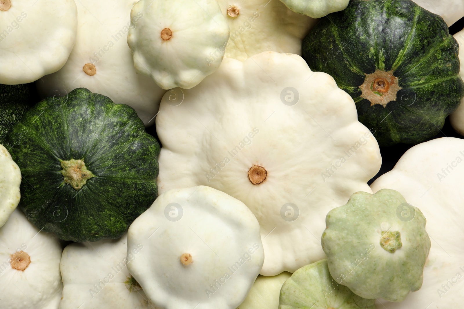 Photo of Fresh ripe pattypan squashes as background, top view