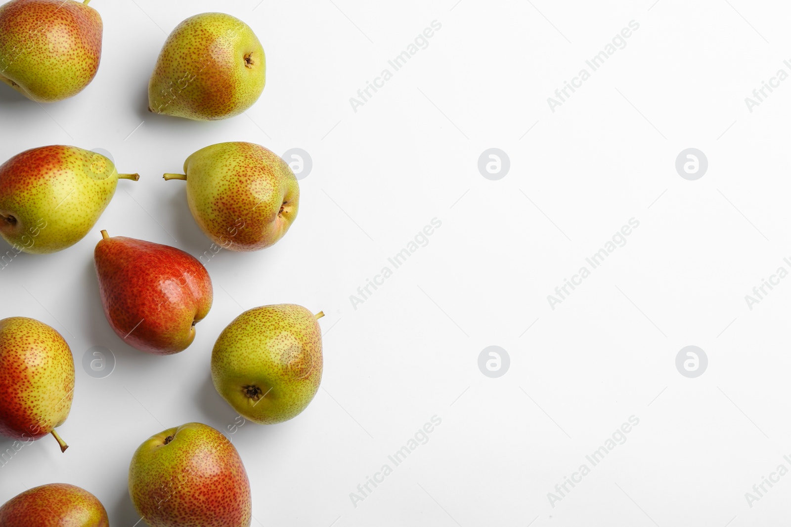 Photo of Ripe juicy pears on white background, top view