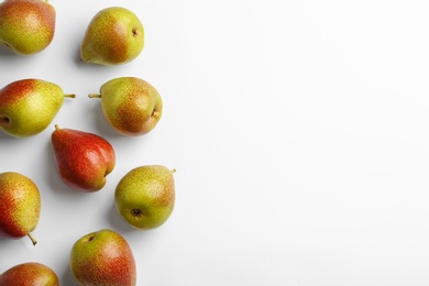 Photo of Ripe juicy pears on white background, top view