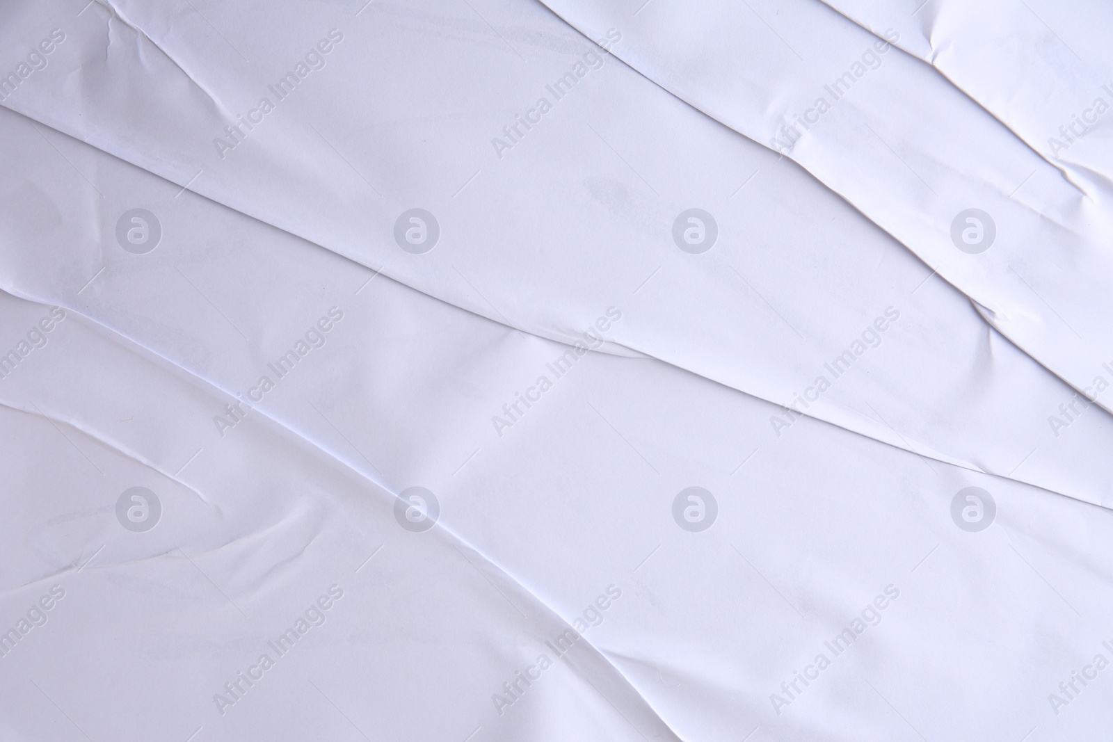 Photo of Texture of white creased paper, closeup view