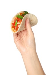 Photo of Woman holding delicious taco with vegetables on white background, closeup