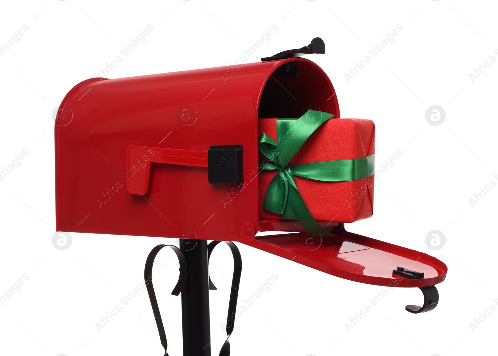 Photo of Red mailbox with Christmas gift isolated on white. Sending present by mail