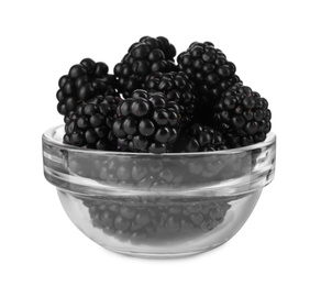 Photo of Fresh ripe blackberries in glass bowl isolated on white
