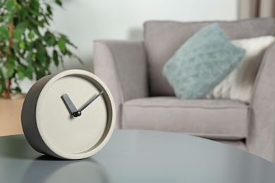 Analog clock on table indoors, space for text. Time management