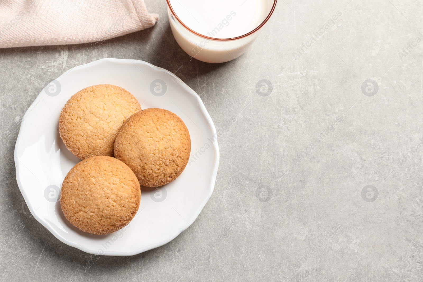 Photo of Plate with Danish butter cookies on table, top view. Space for text