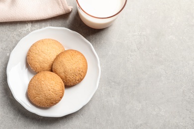 Photo of Plate with Danish butter cookies on table, top view. Space for text