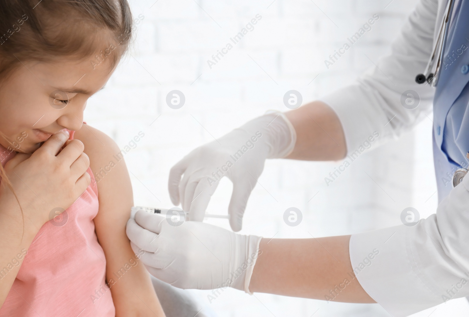 Photo of Doctor vaccinating little girl in hospital