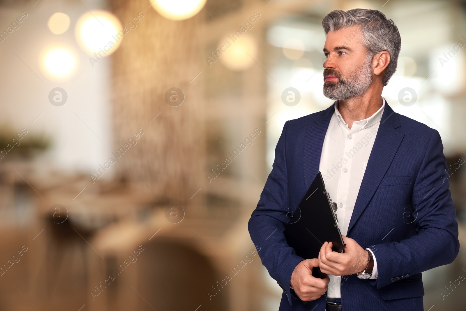 Image of Lawyer with clipboard on blurred background, space for text