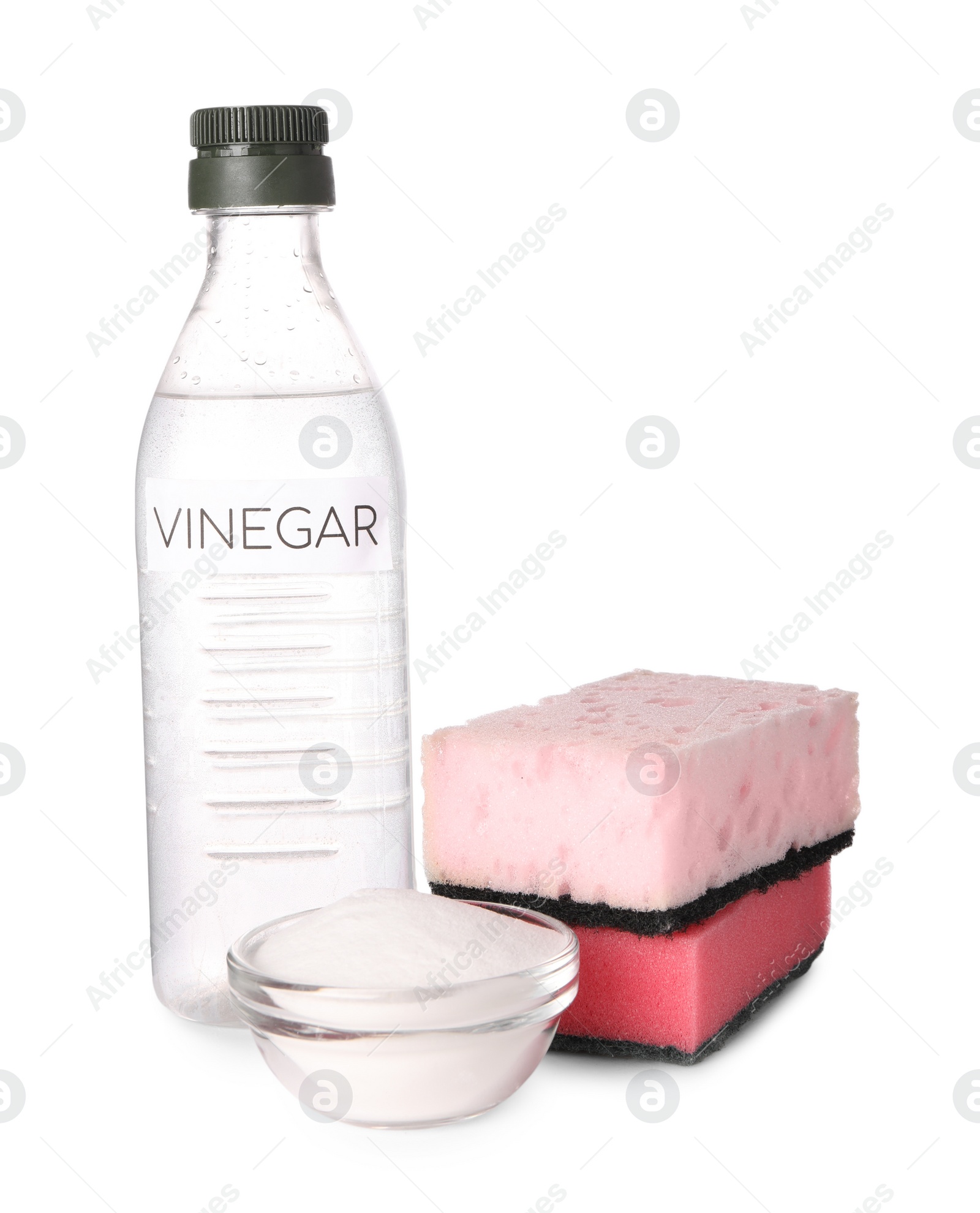 Photo of Eco friendly natural cleaners. Vinegar in bottle, sponges and bowl of soda isolated on white